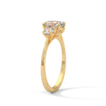 Oval and Round Brilliant Cut Lab-Grown Diamond Three-Stone Engagement Ring in Yellow Gold