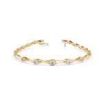 Round Brilliant Cut Lab-Grown Diamond Bezel Station Tennis Bracelet in Yellow Gold