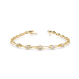 Round Brilliant Cut Lab-Grown Diamond Bezel Station Tennis Bracelet in Yellow Gold