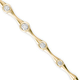 Round Brilliant Cut Lab-Grown Diamond Bezel Station Tennis Bracelet in Yellow Gold