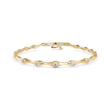 Round Brilliant Cut Lab-Grown Diamond Bezel Station Tennis Bracelet in Yellow Gold