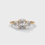 Oval and Round Brilliant Cut Lab-Grown Diamond Three-Stone Engagement Ring in Yellow Gold
