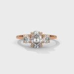 Oval and Round Brilliant Cut Lab-Grown Diamond Three-Stone Engagement Ring in Rose Gold